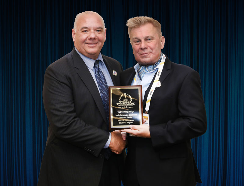 Jospeh Pangaro, a veteran police lieutenant and President of True Security Design accepting one of two Platinum 'ASTORS' Awards at ISC East.
