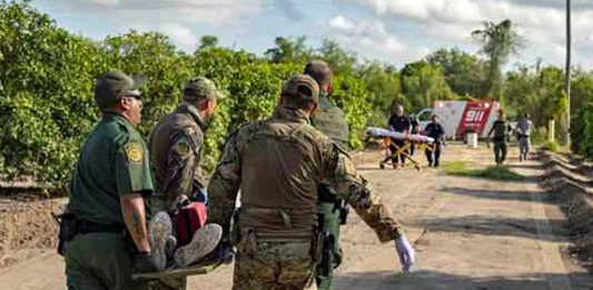 The U.S. Border Patrol, which was was honored in the 2019 ‘ASTORS’ Awards Program for ‘Excellence in Homeland Security’, renders medical aid to a migrant suffering from a heat-related illness found in an orange grove. (Courtesy of CBP by Mani Albrecht)