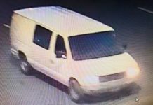 The vehicle is a white van identified as a 1997-2002 Ford E-250 or E-350 Cargo Van. The occupants of the van should be considered armed and dangerous. Please call 911 immediately and do not approach the van.