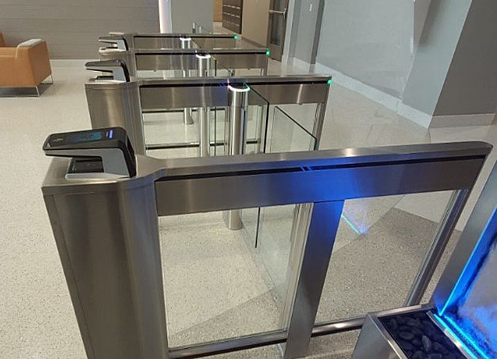 Architecturally minded security designers are managing competing goals of security, safety, health and beauty into today’s entrance control systems, such as Smartphone Access Systems like those from HID Global, which blend well with 2020 Platinum ‘ASTORS’ Award Winner SlimLane EPR Swing Glass Turnstiles.