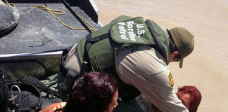 Border Patrol agents from Eagle Pass, Texas, rescue two a woman and her daughter from the Rio Grande River. The journey that illegal border crossers take from their home countries is extremely dangerous, and the danger is more severe during the COVID-19 pandemic. Border Patrol agents from Eagle Pass, Texas, rescue two young women from the Rio Grande River. (Courtesy of CBP by Agent Carl Nagy.)