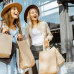 Portrait,Of,A,Two,Happy,Women,With,Shopping,Bags,,Standing
