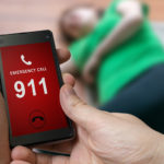 Man,Dialing,Emergency,(911,Number),On,Smartphone.,Injured,Woman,Had