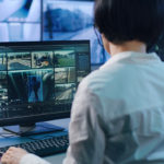 Woman working in modern security center