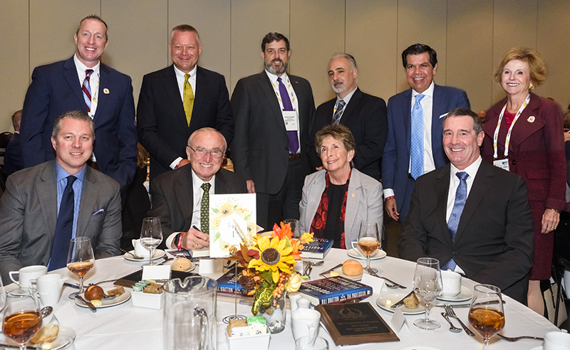 2021 “ASTORS” Awards Luncheon (starting front row, left to right) Michael Struttmann, President and CEO of SIMS Software;  Bill Bratton, executive chairman of TENEO Risk Advisory;  Kathleen Kiernan, president of NEC National Security Systems;  TSA Administrator David Pekoske;  Katherine Cowan, General Counsel of Fortior Solutions;  Raffie Beroukhim, Senior Vice President and Chief Experience Officer of NEC Corporation of America;  David Cagno, chief of staff of TENEO Risk Advisory;  Doug Farber, Infragard National Board Member, Allan Martin, Co-Founder and President of Lumina Analytics, and Mike Dorrington, AMAROK Senior Vice President of Sales and Marketing.