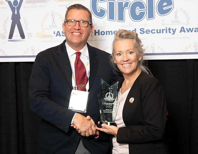 Jeff Wiebell, a Regional Sales Manager at Automatic Systems America, accepting a coveted 2021 ‘ASTORS’ Extraordinary Leadership & Innovation Award, from Tammy Waitt, Editorial Director at AST.