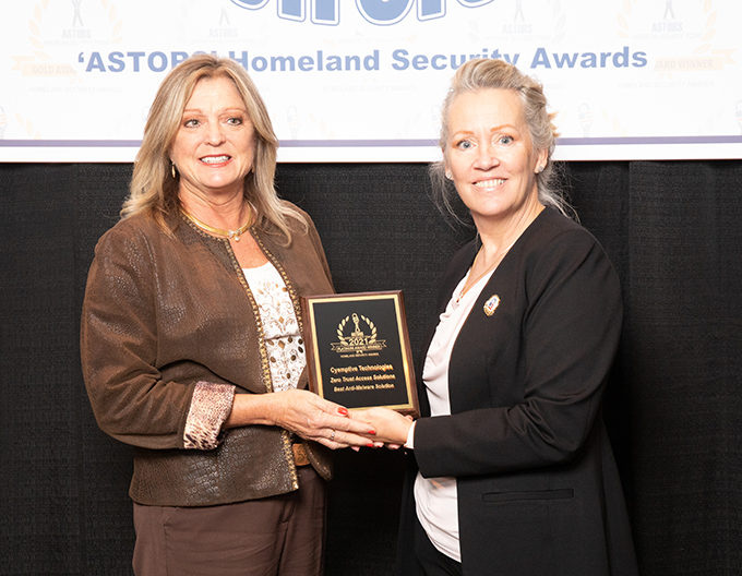 Cyemptive Senior Vice President Lynn McLean accepting the 2021 Platinum 'ASTORS' Award for Best Anti-Malware Solution at the 2021 'ASTORS' Awards Luncheon at ISC East