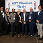 Justin McCue, Theresa Metzler, Jeffrey Pulinat, President David Antar, Jack Plunkett, and Jason McKenna with accept First of Four 2021 ‘ASTORS’ Awarded to IPVideo Corporation at the 2021 'ASTORS' Awards Luncheon at ISC East in New York City.