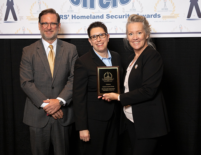 OnSolve CEO Mark Herrington, and CMO Sue Holub accept the First of Three 2021 'ASTORS' Awards for OnSolve Risk Intelligence, and the OnSolve Control Center.
