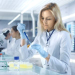 Female,Research,Scientist,Uses,Micropipette,Filling,Test,Tubes,In,A