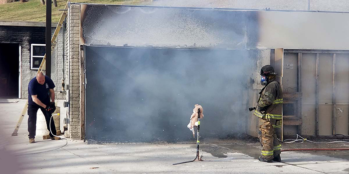 A stuffed animal was placed outside of the open flashover cell to show the effects of radiant heat on other close fuel packages. (Courtesy of USFA)