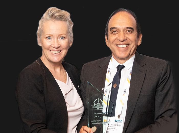 AST Editorial Director Tammy Waitt, presenting Dr. Ray Bassiouni, President & CEO at ATI Systems, with a much-coveted 2021 ‘ASTORS’ Extraordinary Leadership & Innovation Award at ISC East.