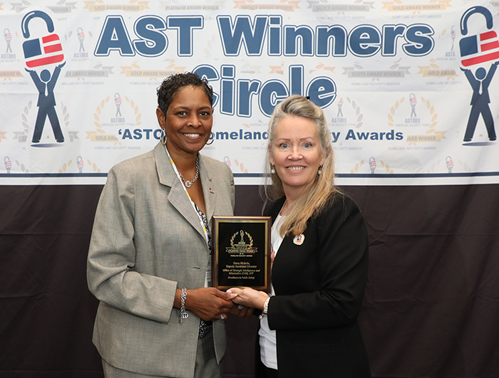 Dana Nichols, Deputy Assistant Director, Office of Strategic Intelligence and Information (OSII), accepts an 'Excellence in Public Safety' Award in the 2022 'ASTORS' Homeland Security Awards Program.