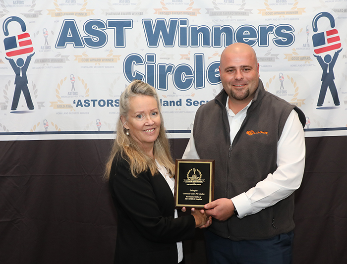 LJ Arlen, Business Development Manager at Gallagher Security accepts a 2022 Platinum 'ASTORS' Homeland Security Award for the Command Centre PIV Solution in New York City.