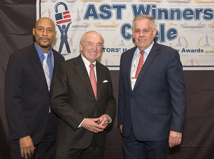 Lieutenant Vincent Collins (at right), a 21-year veteran of the NYPD is the Director of Facilities Security at National Basketball Association (NBA). Shown here with Thaddeus Forman, a Security Specialist with the NBA, and Commissioner Bill Bratton at the 2022 ‘ASTORS’ Awards Ceremony in NYC.