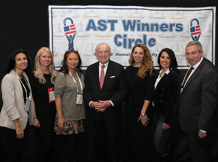 Members of WIIS with Commissioner Bill Bratton, (left to right) Elisa Mula, Co-Founder Moms in Security, and President of EM Designs, LLC; Izabela Regula, Assistant Regional Vice President of ASIS International, Min Kyriannis, CEO of Amyna Systems Inc., who was also recognized for Excellence in Cybersecurity in the 2022 ‘ASTORS’ Awards Program; Janet Fenner, Co-Founder Moms in Security, and President of Defined Marketing; Antoinette King, Co- Founder of Moms in Security, Founder of Credo Cyber Consulting, and Board Member of Advisors for Robotic Assistance Devices, also a 2022 ‘ASTORS’ Multi-Award Winner, and SIA Ethics in Security Technology Working Group and Cybersecurity Advisory Board Member; and Cory Harris, Editor at Security News.