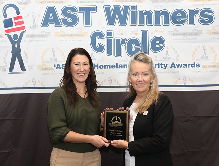 Louise Johnson, the Vice President of Marketing at Xtract One Technologies accepts One of Two 2022 'ASTORS' Homeland Security Awards for Best Metal/Weapons Detection Solution, and Best Pedestrian Entrance Control at ISC East. 