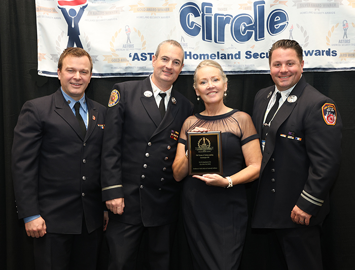 Firefighter Joshua Raeben, Lieutenant Thomas Bendick, and Captain Jerry Perillo, of the Fire Department of New York (FDNY) accept a 2023 ‘ASTORS’ Excellence in Public Safety and Community Resilience Award on behalf of the FDNY Bureau of Training Learning Technologies Unit, at ISC East in New York City on November 16th, 2023.