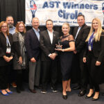 Team IPVideo Corporation, including Benjamin Tabler, Corporate Counsel; Nellie Quintana, Director of Supply Chain; Steve Grillo, CFO (fifth from left); David Antar, President - also Named 2023 Industry Leader of the Year; Rick Cadiz, VP of Sales & Marketing; of IPVideo Corporation; Michele Della Croce, Supply Chain Manager; and Frank Jacovino, VP Product Development; are presented with a prestigious 2023 ‘ASTORS’ Leadership & Innovation Award, from AST’s Managing Director Tammy Waitt.