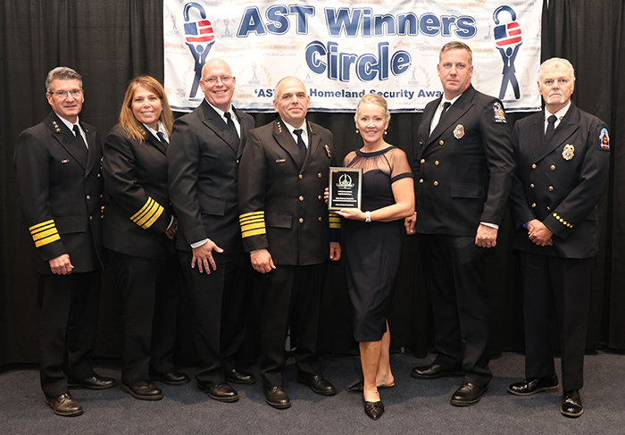 Deputy State Fire Administrator BILL DAVIS, Deputy State Fire Administrator LUCI LABIOLA-CURRE,, Fire Protection Specialist TIM GRAVES (also Recognized independently), and State Fire Administrator JAMES CABLE, accept a 2023 ‘ASTORS’ Excellence in Public Safety and Community Resilience Award on behalf of the New York State Division of Homeland Security and Emergency Services (NYS DHS ES) Office of Fire Prevention and Control, along with Fire Protection Specialist Chris Gould, and State Fire Instructor Mahlon Irish on November 16th 2023 in New York City, for the Firefighter Cancer Awareness and Contamination Reduction Program.