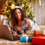 Young,Woman,With,Credit,Card,,Gifts,,And,Laptop.,Online,Shopping